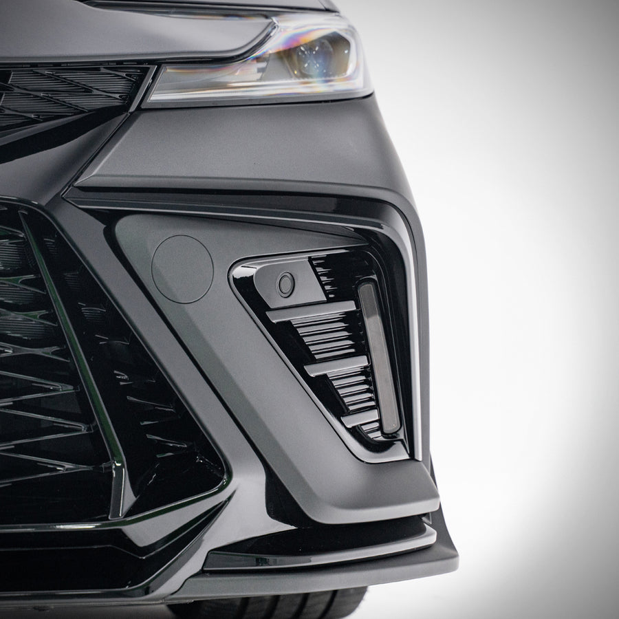 Detail of the YOFER front bumper corner intake on a grey 2025-2026 Toyota
Camry, showing the DRL housing, finned insert and splitter lip