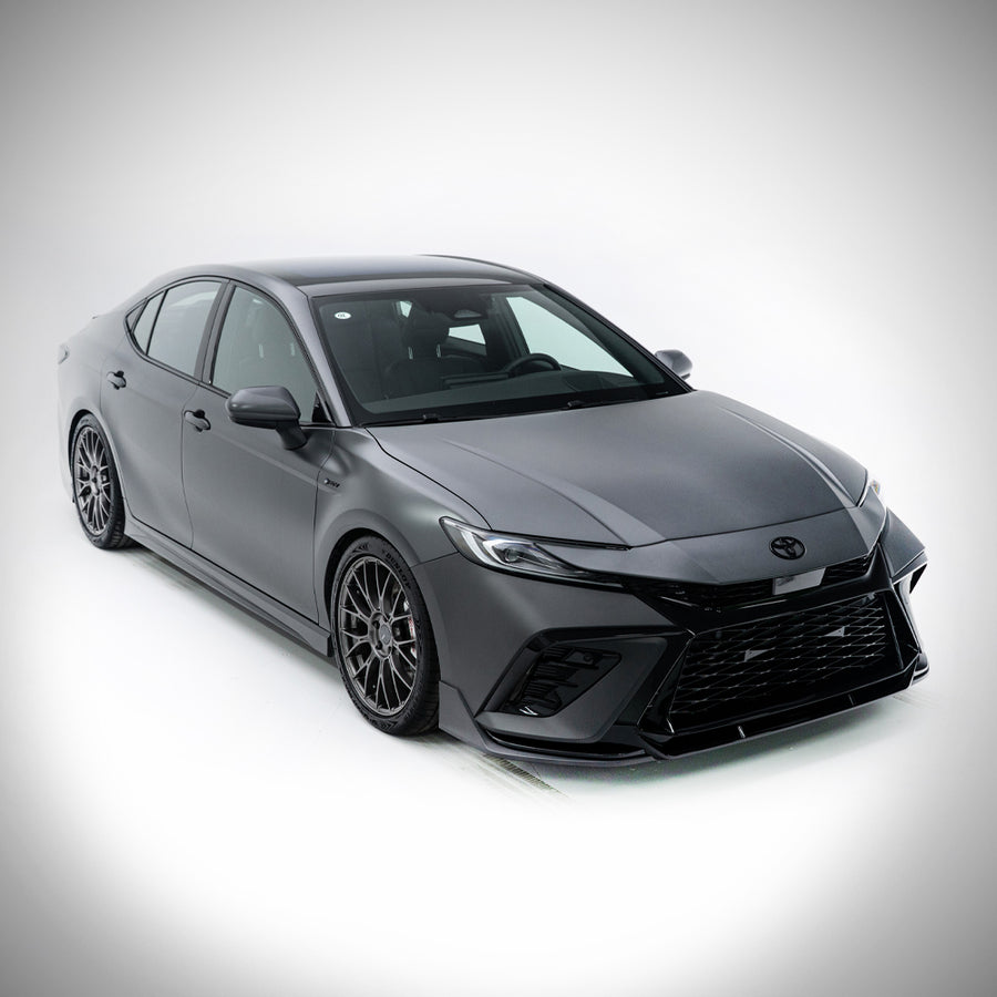 Grey 2025-2026 Toyota Camry with the YOFER front bumper, elevated
studio view on white showing the full front-end profile