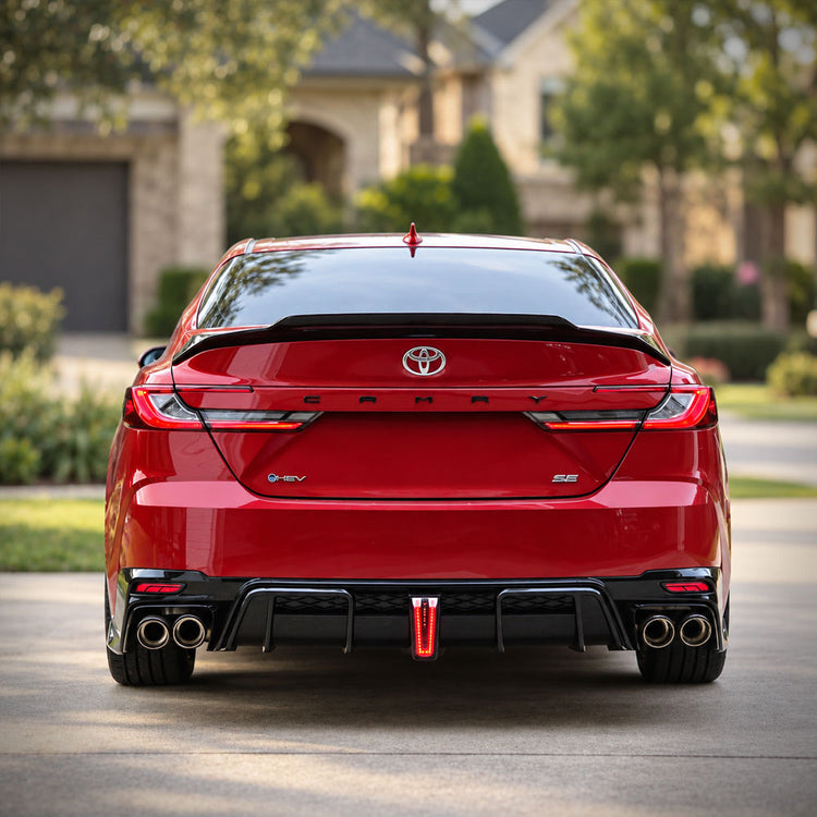 Red 2025-26 Toyota Camry rear view with YOFER quad-exit exhaust, dual-cutout rear diffuser, and trunk spoiler