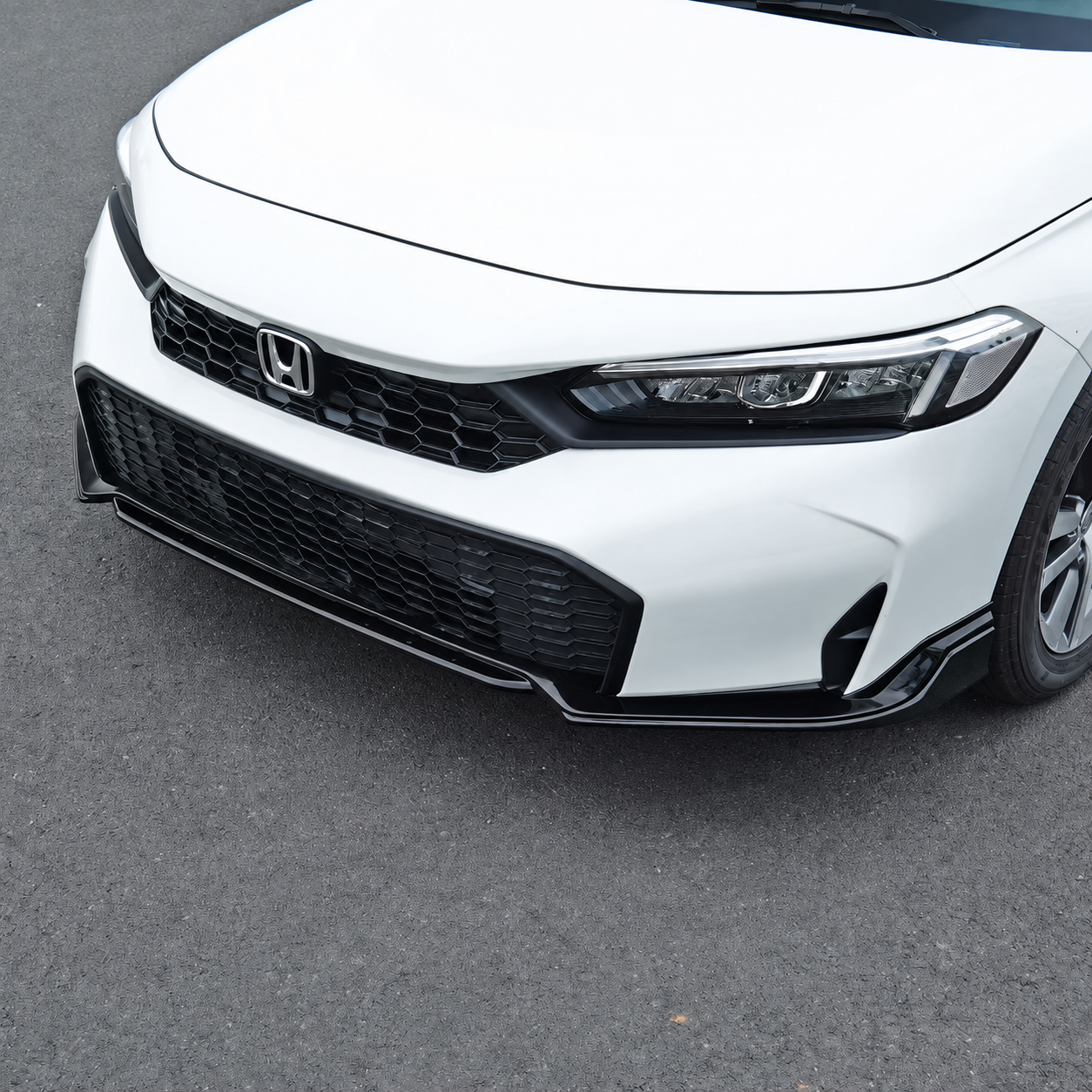 Gloss black V2 front lip installed on a 2025-2026 Honda Civic Sedan or Hatchback